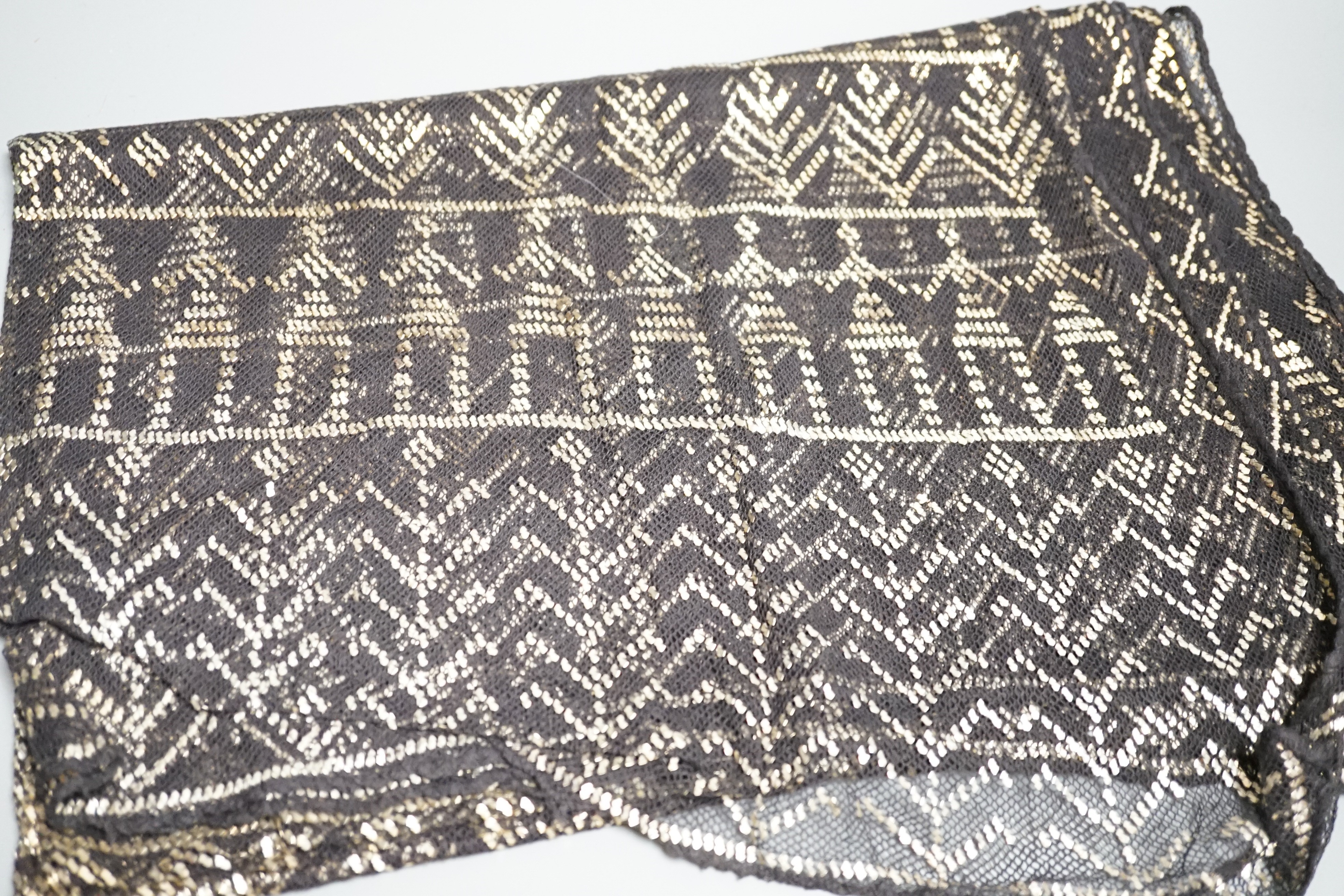 A vintage 1920's silver mesh evening bag, a black evening shawl woven with silver thread, length 240cm